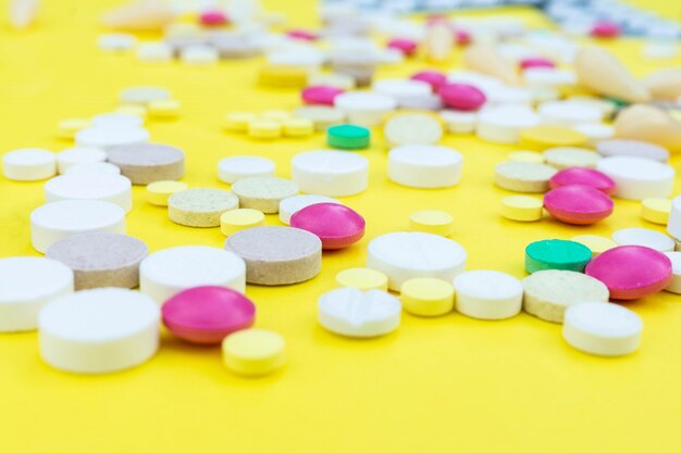 Pills on a yellow background