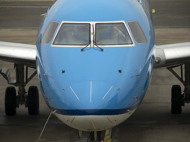 Pilots of airplane while parking at the terminal