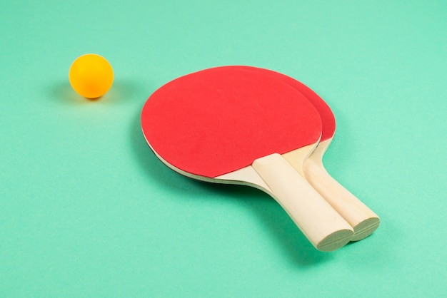 Pin pong on an green background.