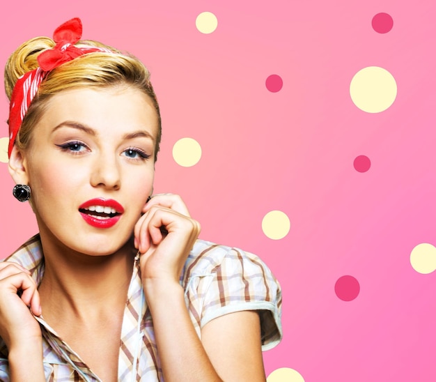 Pin-up style portrait of surprised blonde woman sepia toned