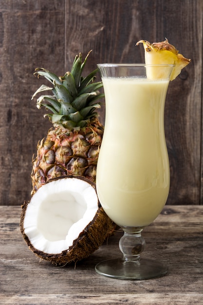 Piña colada cocktail on wooden