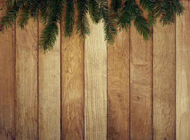 Pine branch on a wooden table