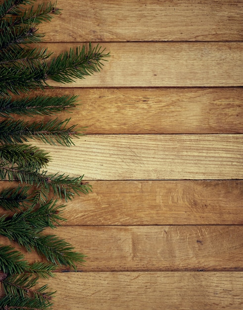 Pine branch on a wooden table