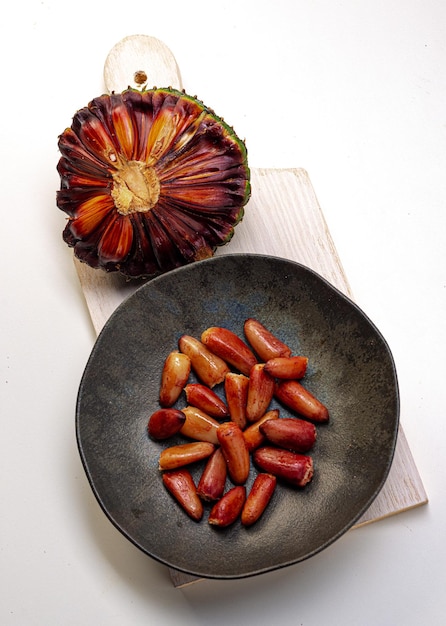 Pine cone and pine nuts (typical araucaria seed used as a condiment in Brazilian cuisine). Pine nuts