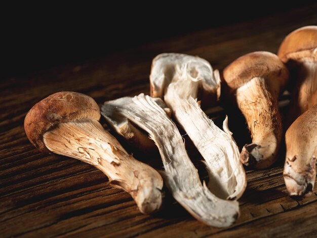 Pine mushrooms on an old chopping board