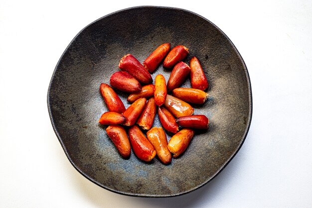 Pine nuts cooked inside a rustic ceramic dish. Typical winter food in southern Brazil.