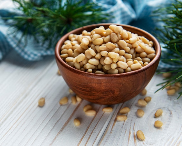 Pine nuts on a old wooden background