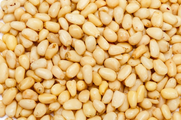 Pine nuts on white