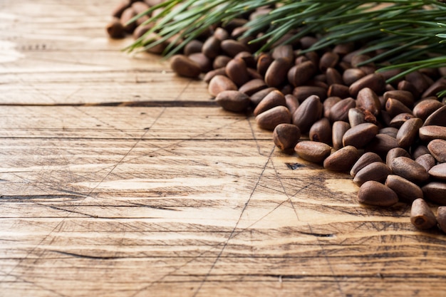 Pine nuts on a wooden surface