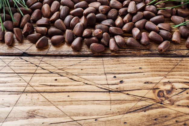 Pine nuts on a wooden surface