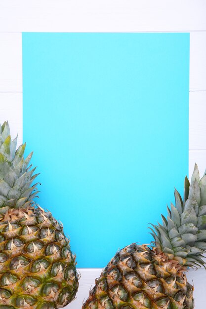 Pineapple on a blue background, with copy space