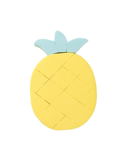 Pineapple figurine made of foam sponges isolated on a white background