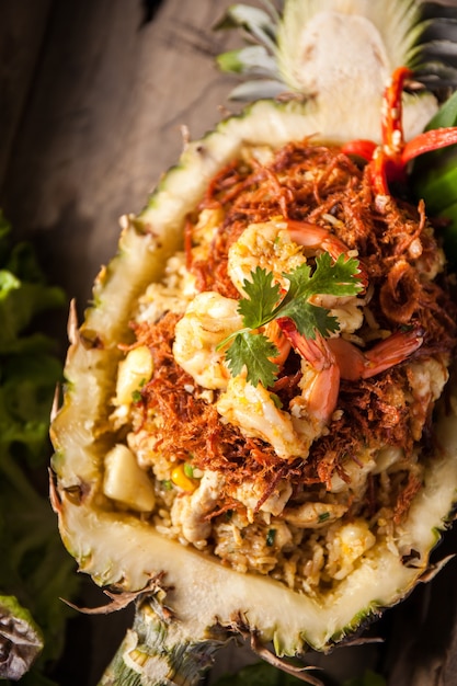 Pineapple Fried Rice on Wooden Plate