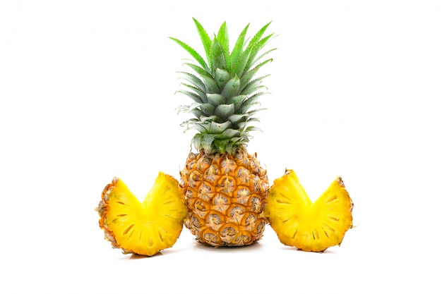 Pineapple fruit sliced on white surface