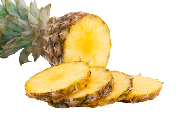 Pineapple fruit with slices isolated on white background.