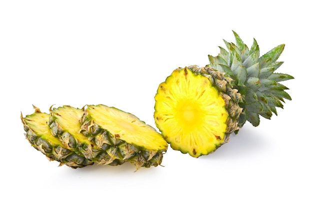 Pineapple half and slice on white background