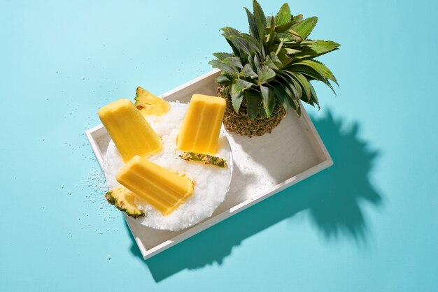 Pineapple ice pops on a tray