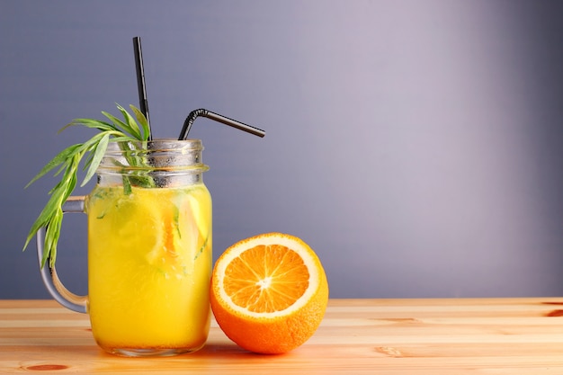 Pineapple and orange cocktail. non alcoholic citrus summer drinks on wooden table