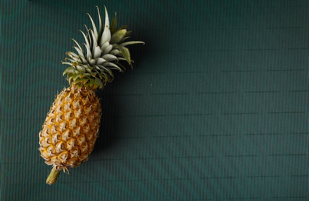 Pineapple on paper green background