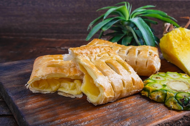 Pineapple Pie and Pineapple Fruit on a Wooden Background