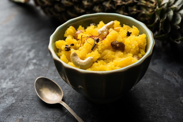 Pineapple sheera or Halwa also known as Ananas keshri shira. Popular South Indian Dessert recipe. selective focus