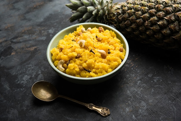 Pineapple sheera or Halwa also known as Ananas keshri shira. Popular South Indian Dessert recipe. selective focus