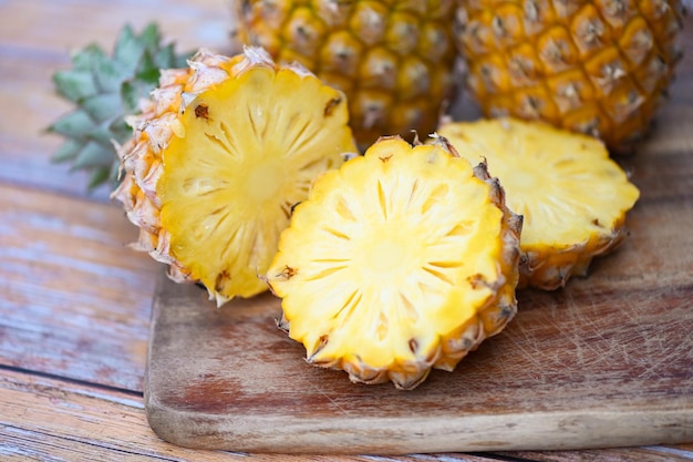 Pineapple slice on plate for food fruit ripe pineapple on wooden background fresh pineapple tropical fruits summer