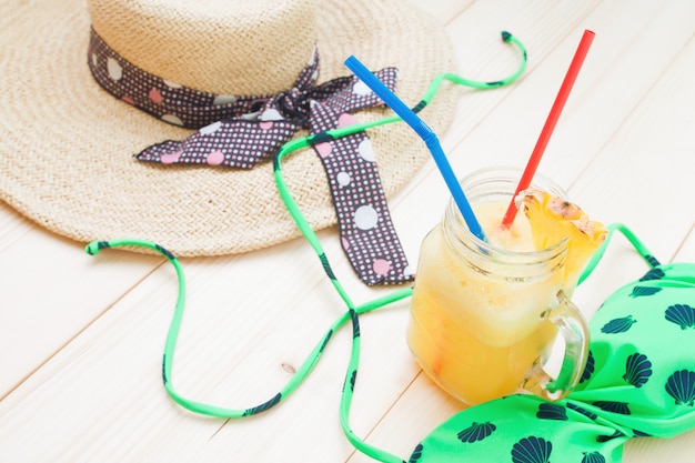 Pineapple smoothie with woman's accessories 