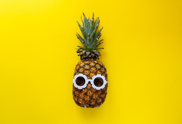 Pineapple in White Sunglasses on the Colorful Background, Creative Summer Concept