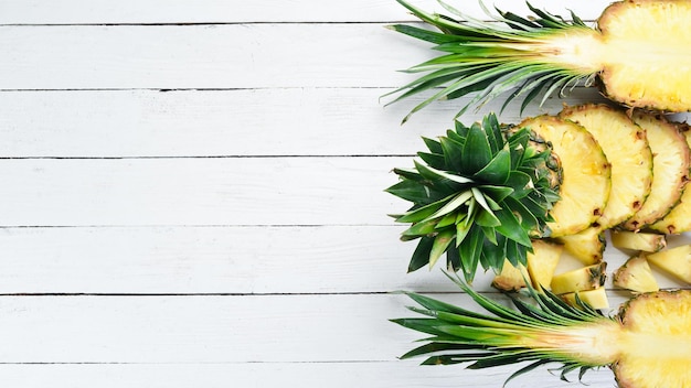 Pineapple on a white wooden background Tropical Fruits Top view Free copy space