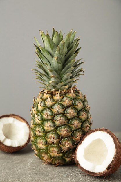 Pineapple with coconut on grey background Tropical fruit