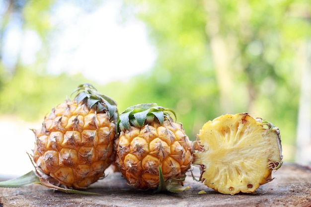 pineapple on the wood texture background.