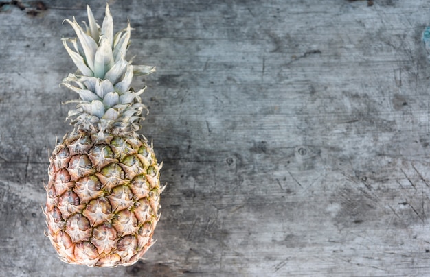 Pineapple on wooden background