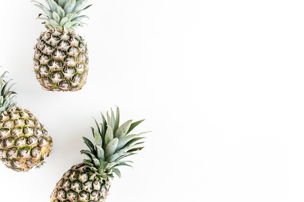 Pineapples isolated on white background food concept flat lay top view