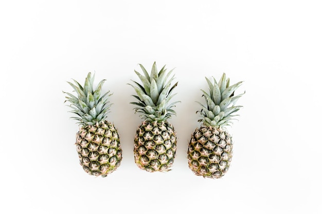 Pineapples isolated on white background food concept flat lay top view