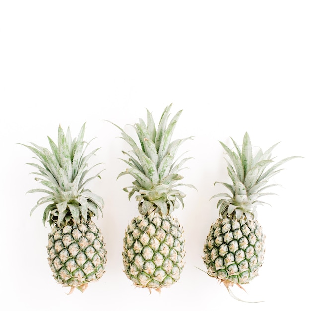 Pineapples on white. Creative food concept