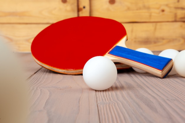 Ping pong equipment on wooden table close up