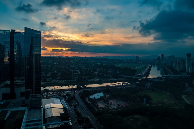 Pinheiros River Surrounded by Trees and Offices