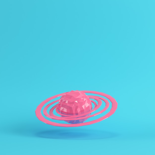 Фото Розовая абстрактная планета с кольцами на ярко-синем фоне