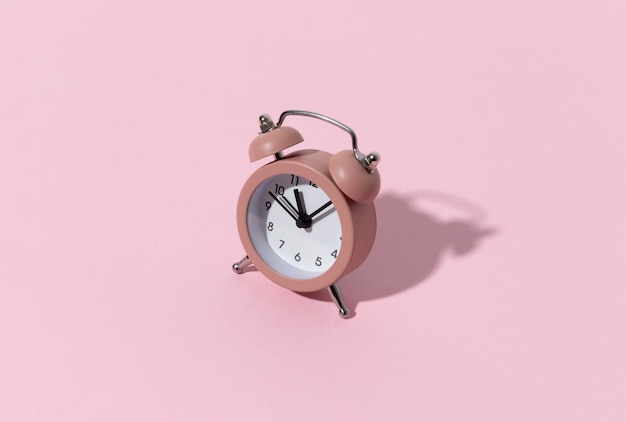 Pink alarm clock with copy space