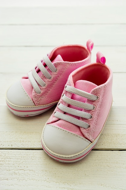 Pink baby girl shoes,  Newborn, motherhood, pregnancy concept with copy space.