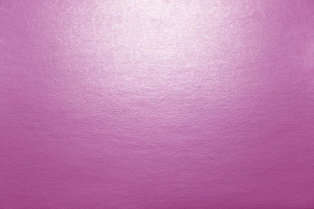 Розовый фон, текстура картона с освещением.