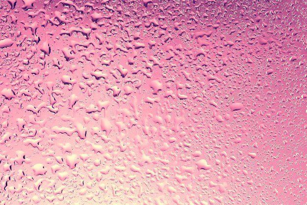 Sfondo rosa gocce di vetro texture astratta