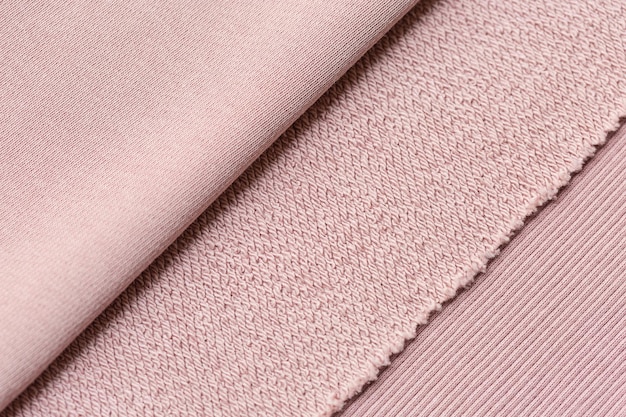 Pink background texture of knitted wool. Knitted fabric.