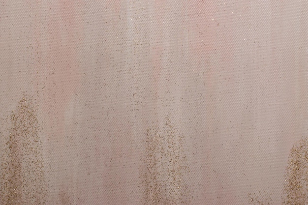 A pink background with a gold glittery texture.