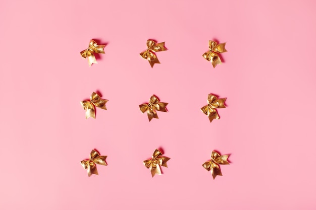 Pink background with golden bows