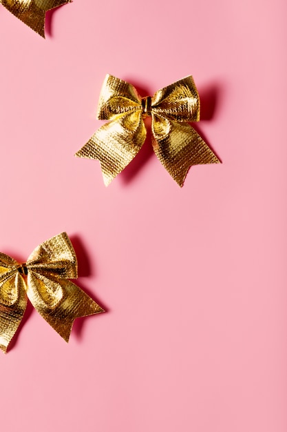 Pink background with golden bows