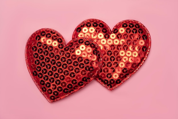 Pink background with red hearts balloons