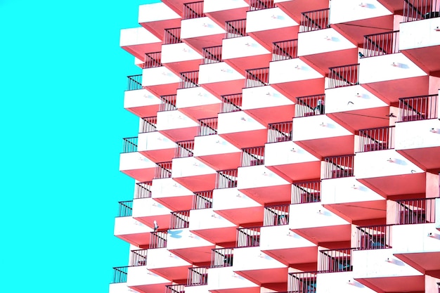 Photo pink balconies and blue sky