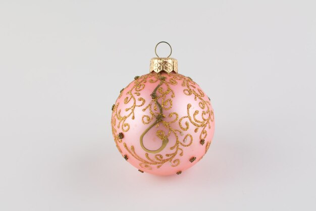 Pink ball for christmas tree on white background